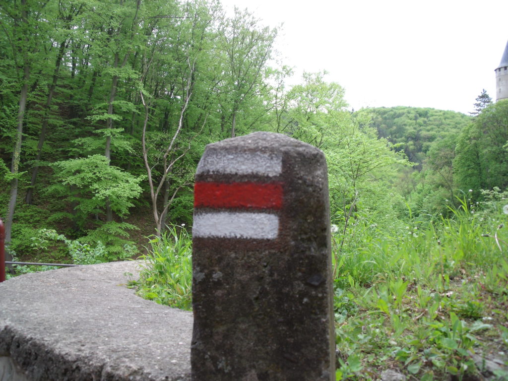 A red trail marker